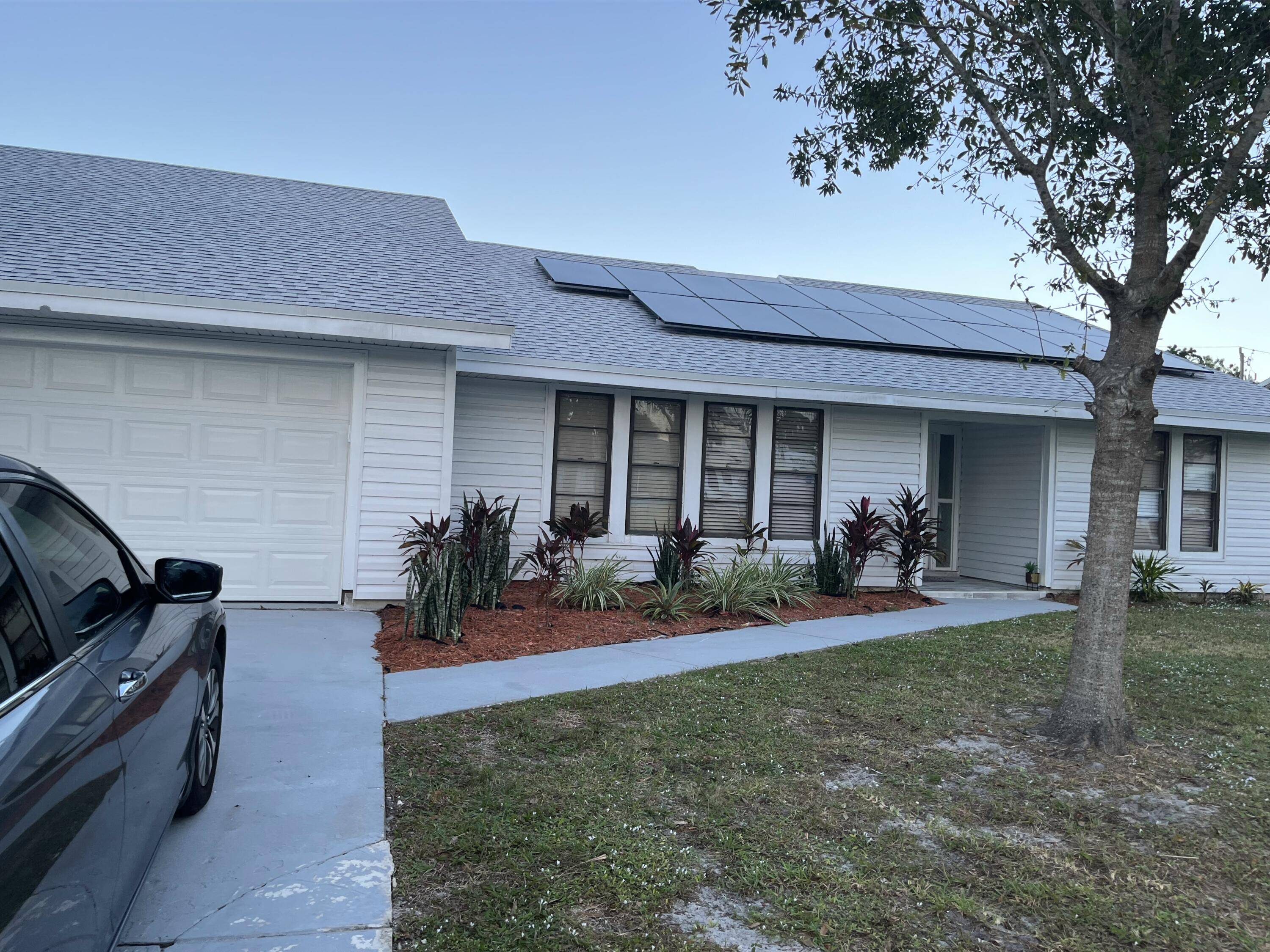 This spacious home offers 1991 SqFt of living area, featuring a new roof installed in December 2021.
