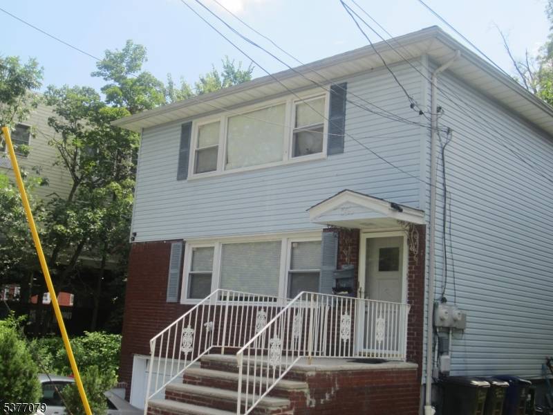 Well maintained 2Fam house features large rooms, renovated 1st floor, 3BRs each floor, central A C, finished basement w full bath, separate gas heat, flood insurance may be required.