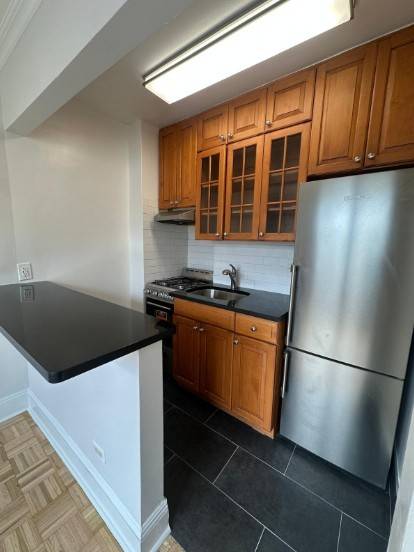 Beautiful alcove studio with large private balcony in a prime Midtown West location near Columbus Circle and Central Park !