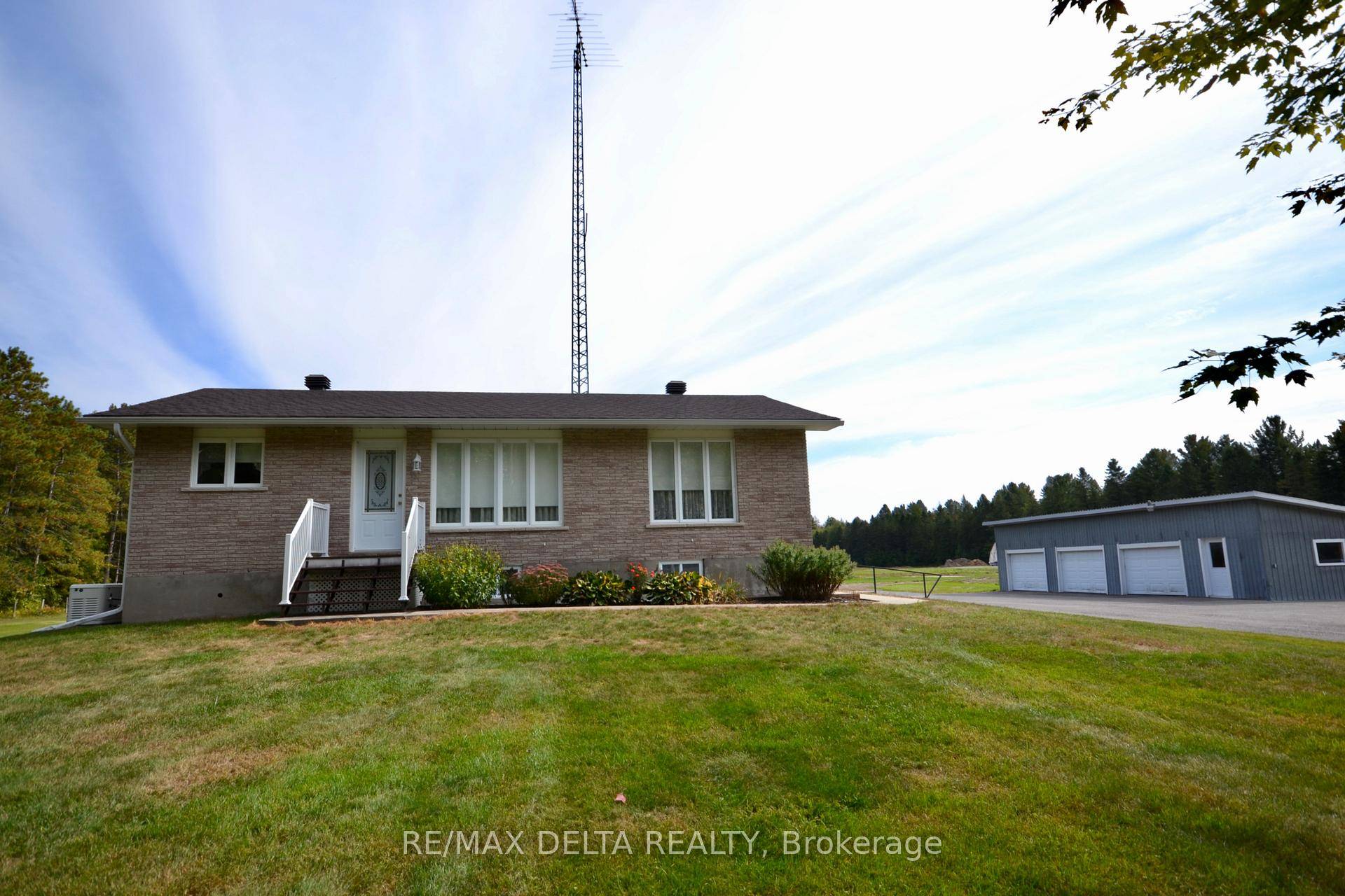 Beautiful all brick Bungalow on a large country lot a true hobbyist delight !