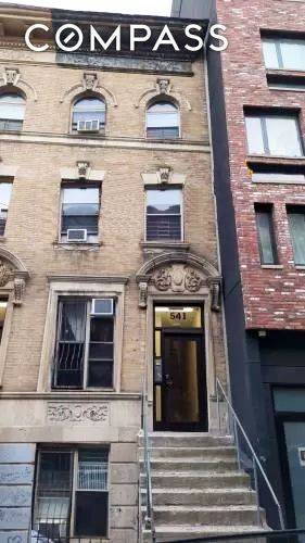 Just steps from Broadway, this vacant fixer upper townhouse is flooded with natural light and ready to be reimagined.