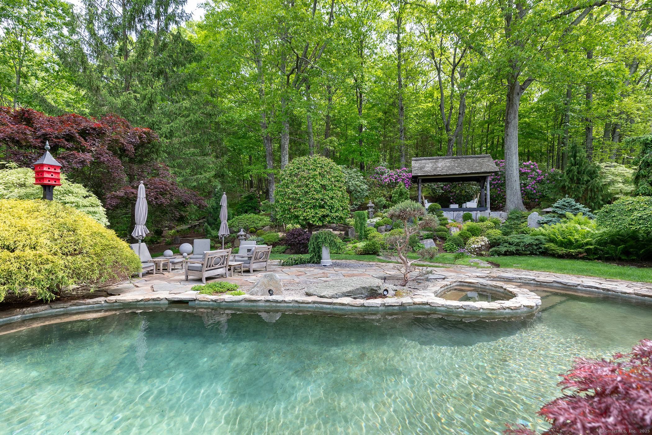 Privately Sited on a Hill in the Midst of 31 acres, this Elegantly Renovated 5, 000 sq ft Colonial Offers Panoramic Sunset Views and Exceptional Privacy.