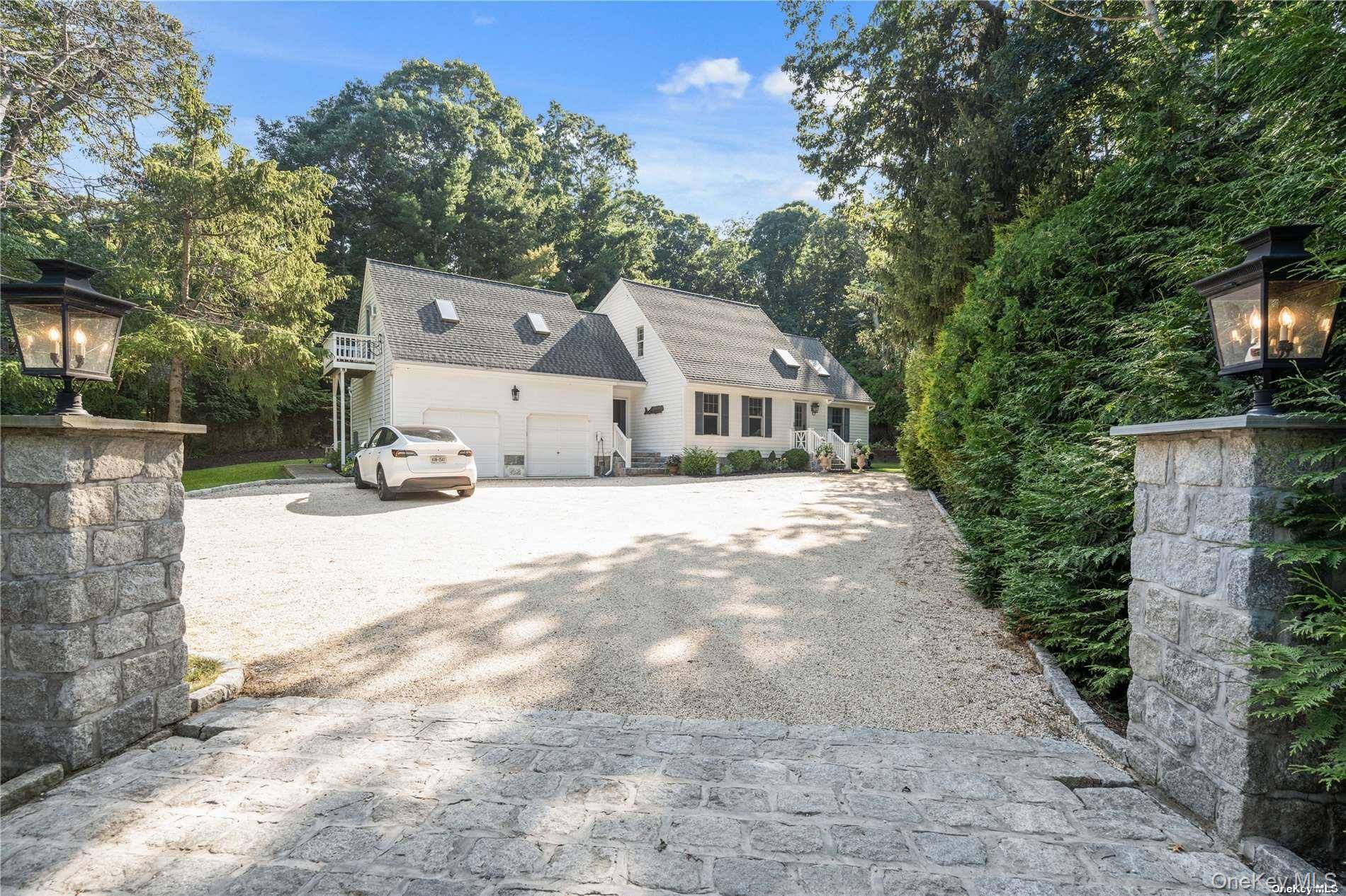 Decorator s Own ! Welcome to this beautiful Expanded Ranch, where modern elegance meets classic Hamptons charm.
