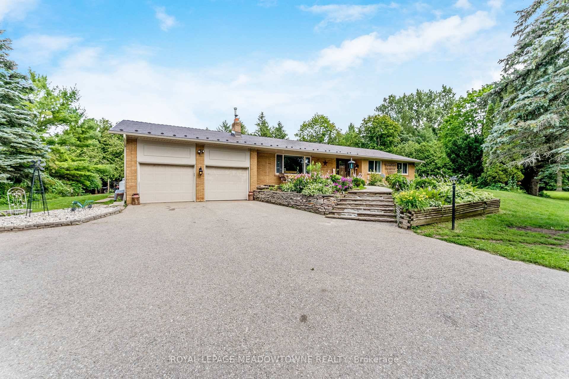Welcome to this rare bungalow retreat, set on sprawling acres of pristine land just moments from Caledon Village.