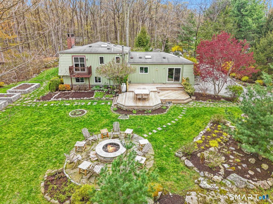 Set on a level 2 acre property, bordered by over 200 acres of protected nature preserve with scenic trails, this exceptional home offers a rare blend of privacy, convenience, and ...