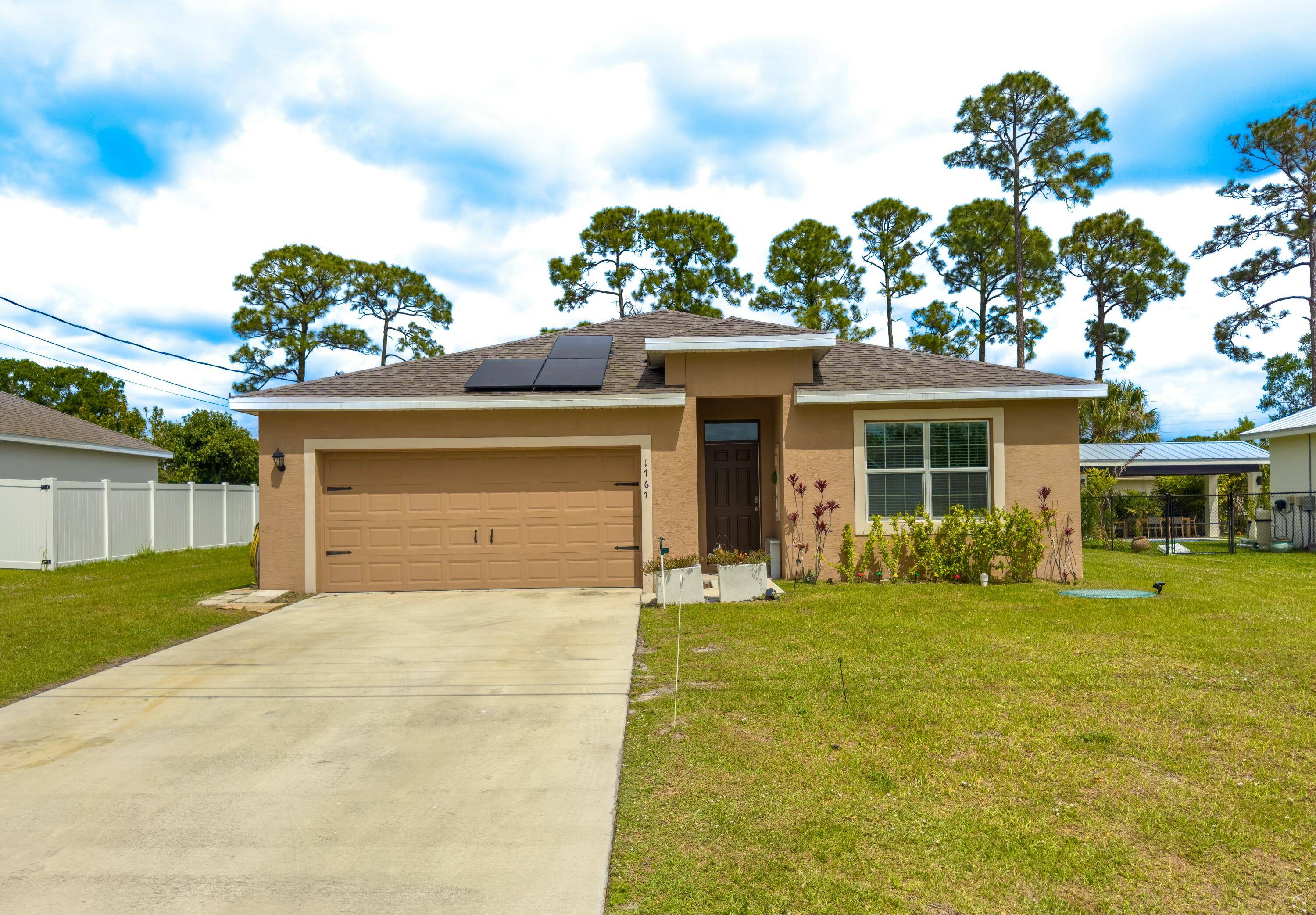 Welcome to this stunning 4 bedroom, 2 bathroom home with a 2 car garage and an extended living room floor plan by D.