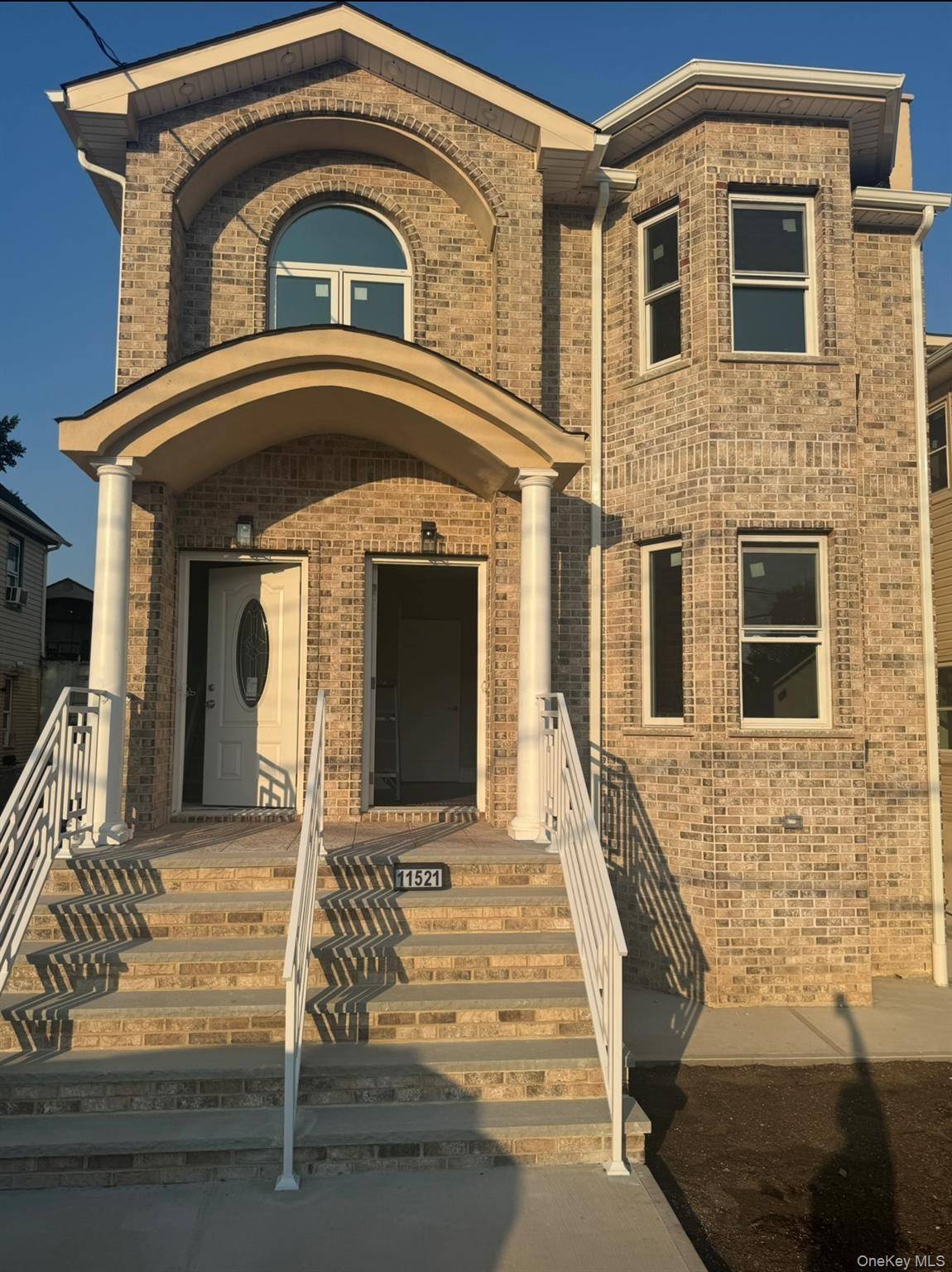 Newly constructed two family detached residence features spacious living areas with 3 bedrooms and 2 full bathrooms, plus a private balcony.