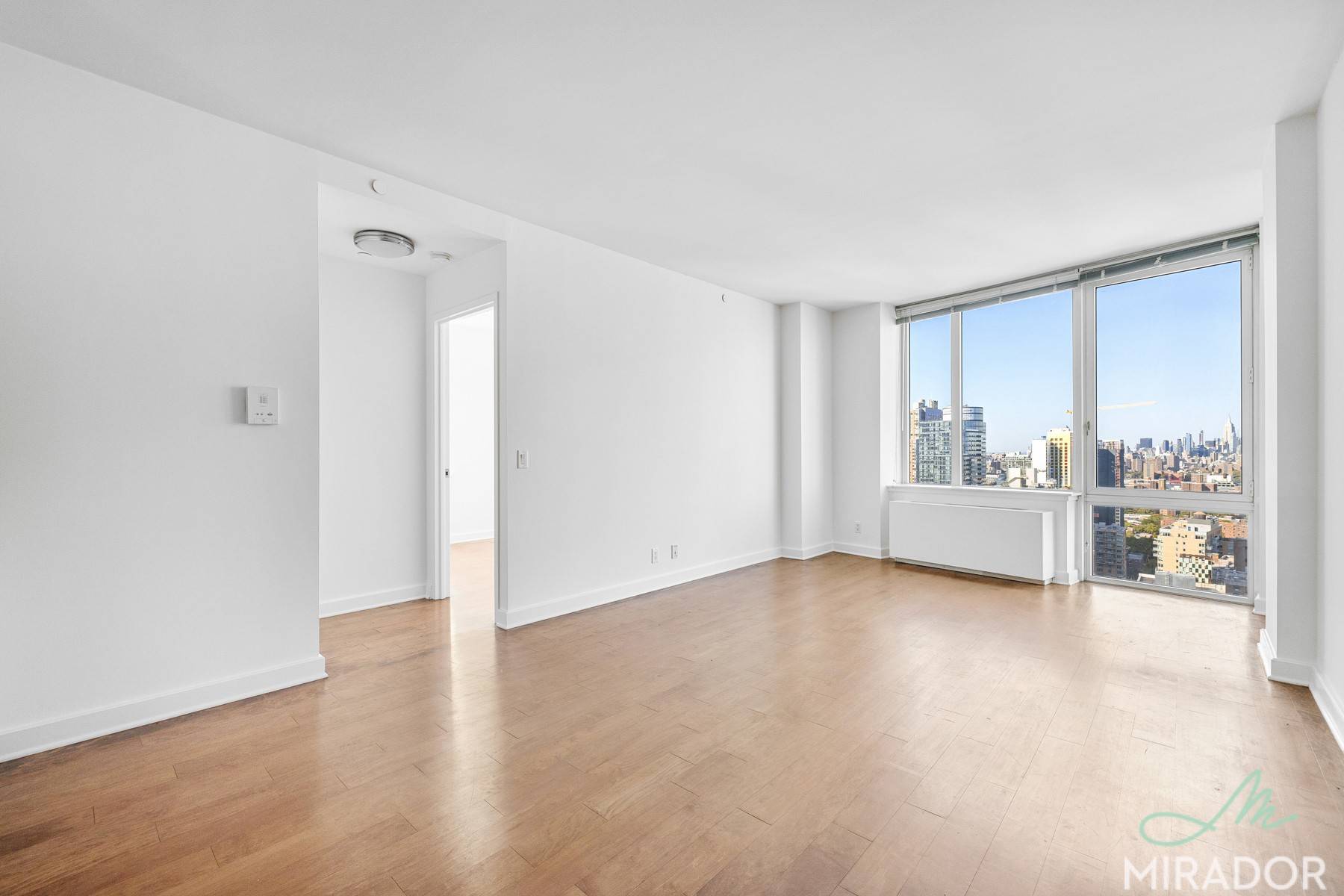 Rarely available, two bedroom, two bathroom, double corner unit soaring above Fort Greene Park.