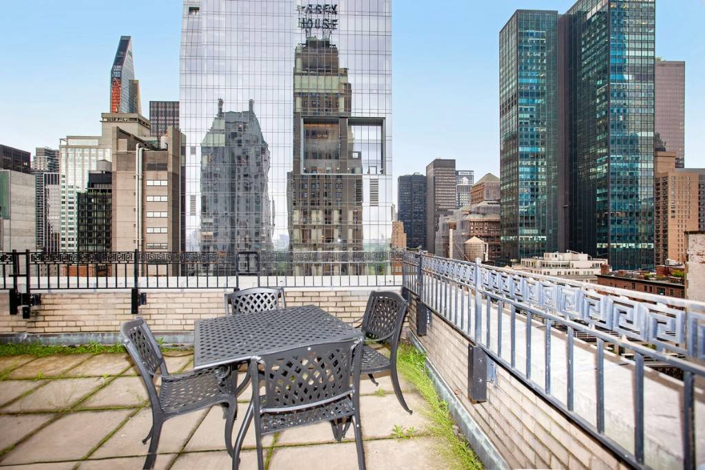 Beautifully renovated two bedroom two bath facing south with terrific Manhattan Skyline views and a private 20x20 terrace.