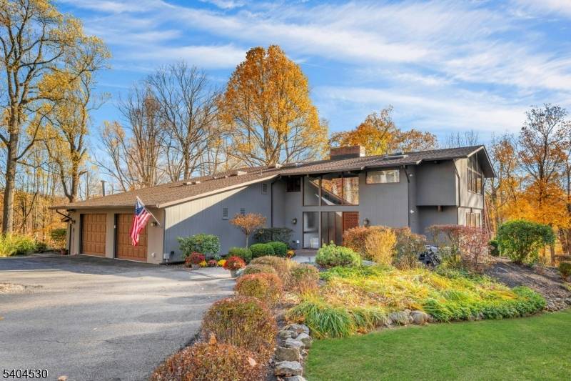 Discover this stunning custom designed contemporary home featuring soaring ceilings in the foyer and family room, creating an open and airy ambiance.