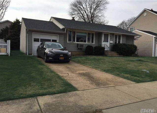 Bright, spacious ranch with large backyard and covered patio.