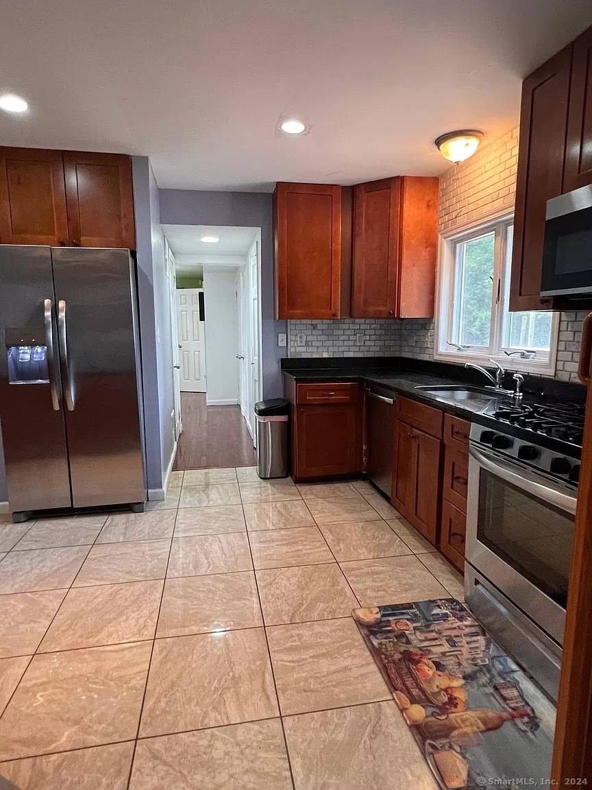 Conveniently located close to shopping, public transportation a short drive to the Merritt, train station and downtown Stamford, this lovely spacious and totally updated home in a desired neighborhood is ...