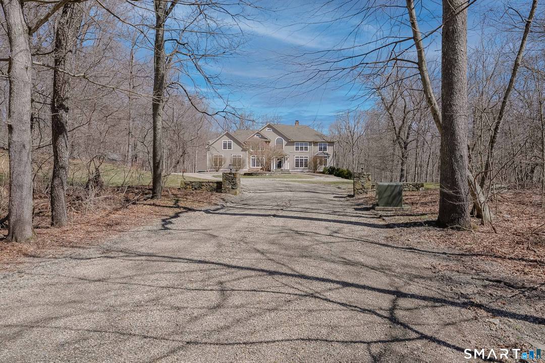 Nestled on nearly seven private acres along a quiet country road in picturesque Roxbury, this exceptional residence offers a seamless blend of elegance, comfort, and classic New England charm.