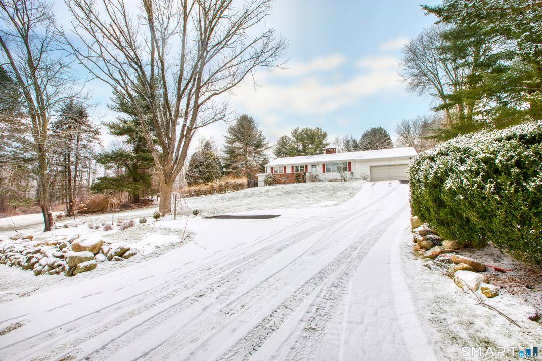 Nestled at the end of a quiet cul de sac, this impeccably maintained ranch style retreat offers the perfect balance of rustic warmth and contemporary elegance.
