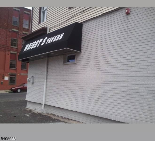 Mixed use property located on a high traffic corner along Summer Street, surrounded by established businesses.