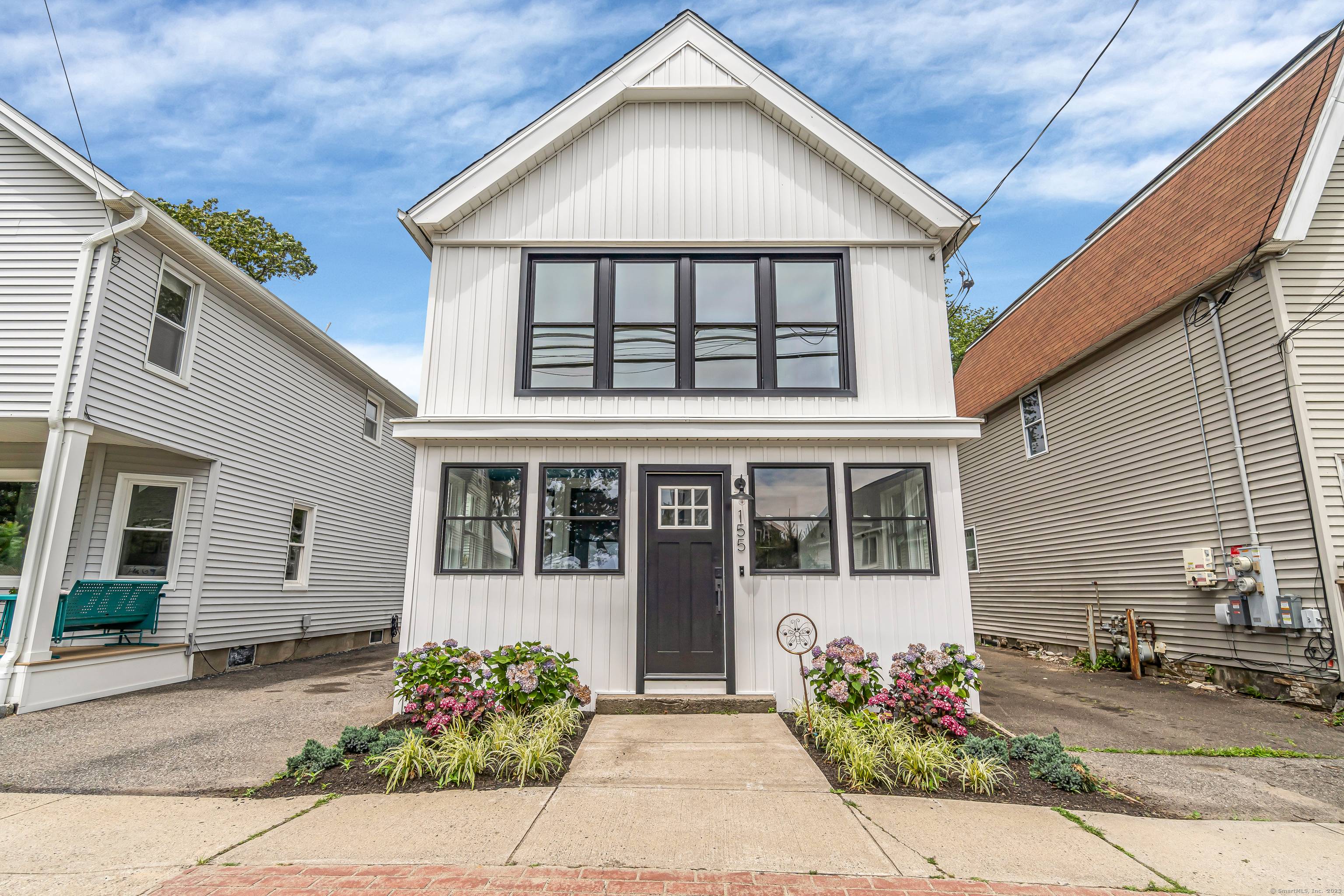 Nestled in Milford's charming beach community, a storybook Craftsman style home.
