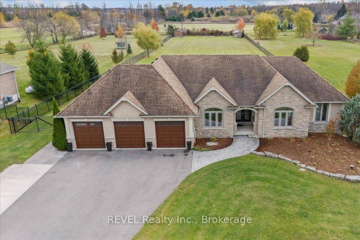 Welcome to your forever home in the serene Hamlet of Millgrove, where timeless design, family friendly space, and countryside charm meet on an expansive 1.