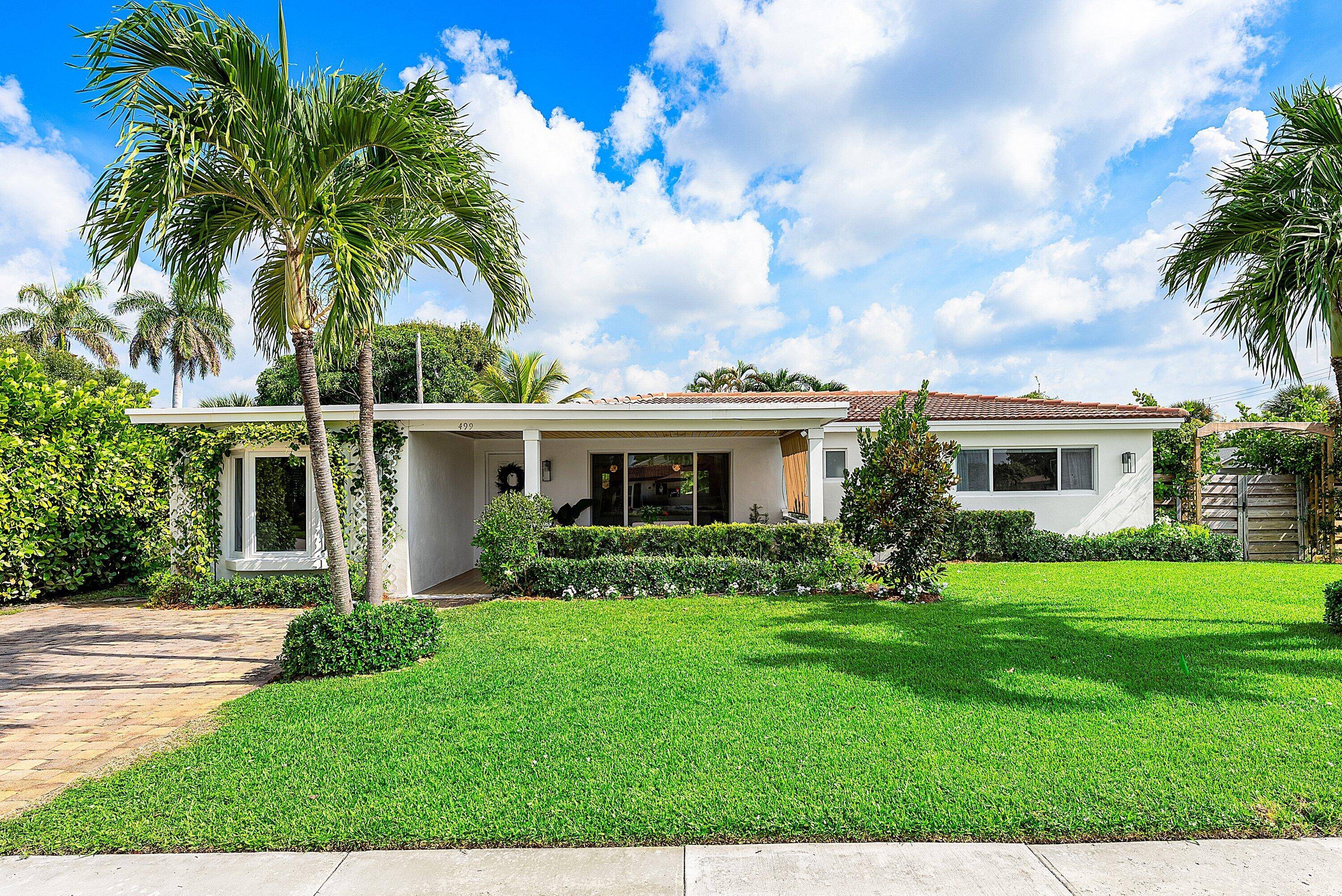 Welcome to 499 NE 28th Road, a coastal gem in East Boca Raton's sought after Chatham Hills.