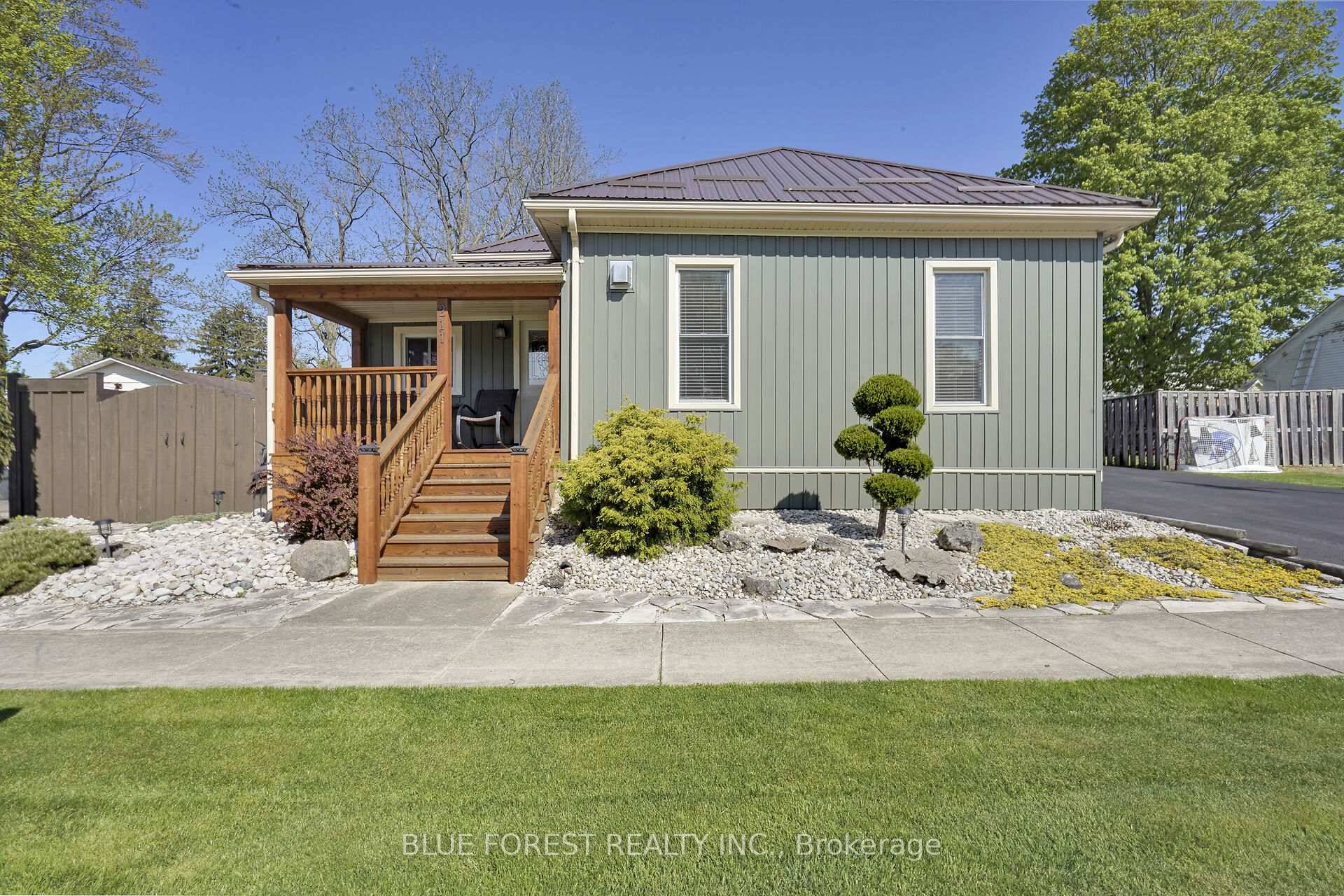 This immaculately maintained property offers timeless curb appeal and charm.