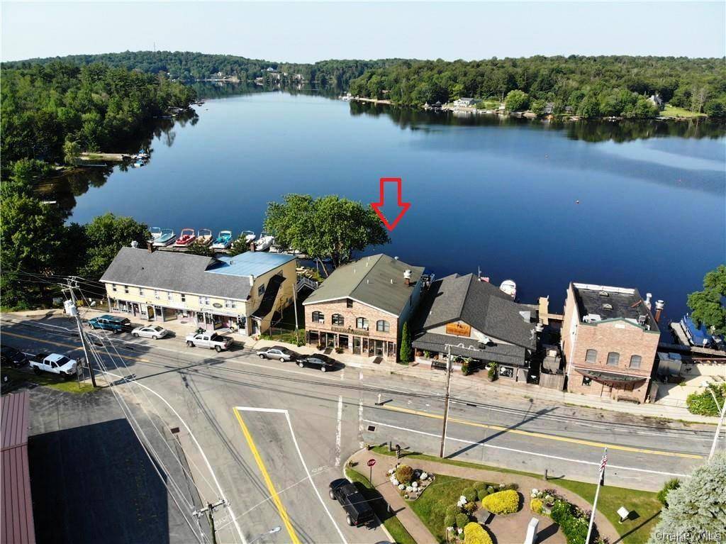 Beautifully renovated commercial building is located right on Restaurant Row with fabulous frontage on desirable Kauneonga Lake in the Town of Bethel.