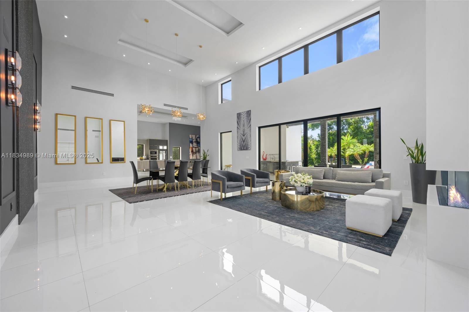 Modern masterpiece on expansive grounds, boasting soaring 20 ft ceilings, sleek porcelain floors, and a chef s kitchen with custom cabinetry and quartz counters.