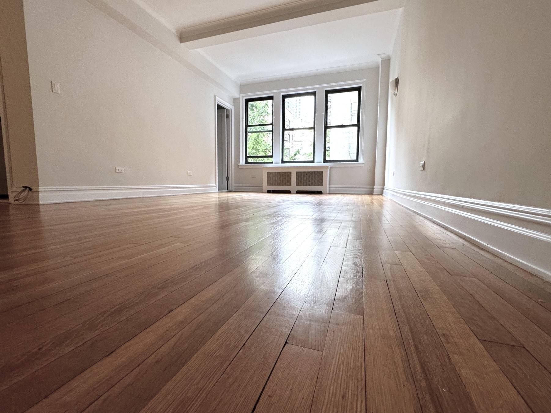 Located in an immaculate pre war doorman building, this one bedroom home features a renovated windowed kitchen and bathroom, hardwood floors throughout, high ceilings, large living room, and multiple closets.
