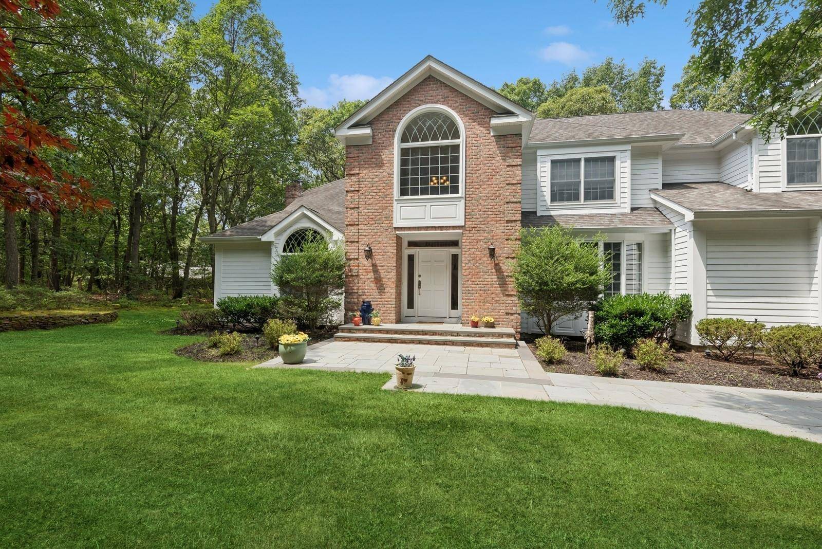 A truly exceptional home in the acclaimed Three Village School District !
