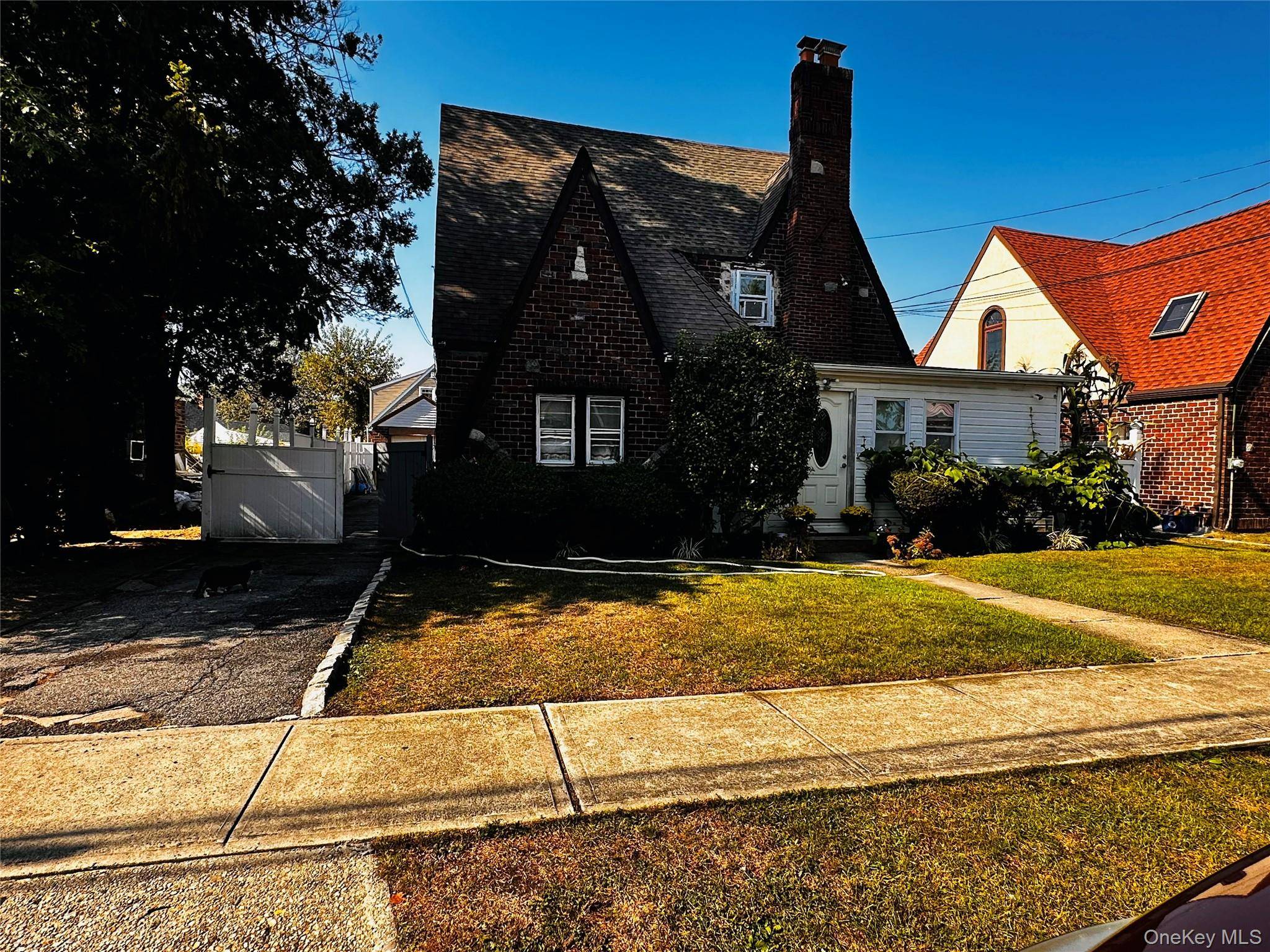 Welcome to this inviting Tudor Cape Style House, Great Opportunity, Large Spacious Rooms, Mother Daughter, Private Back Yard, Uniondale Schools.