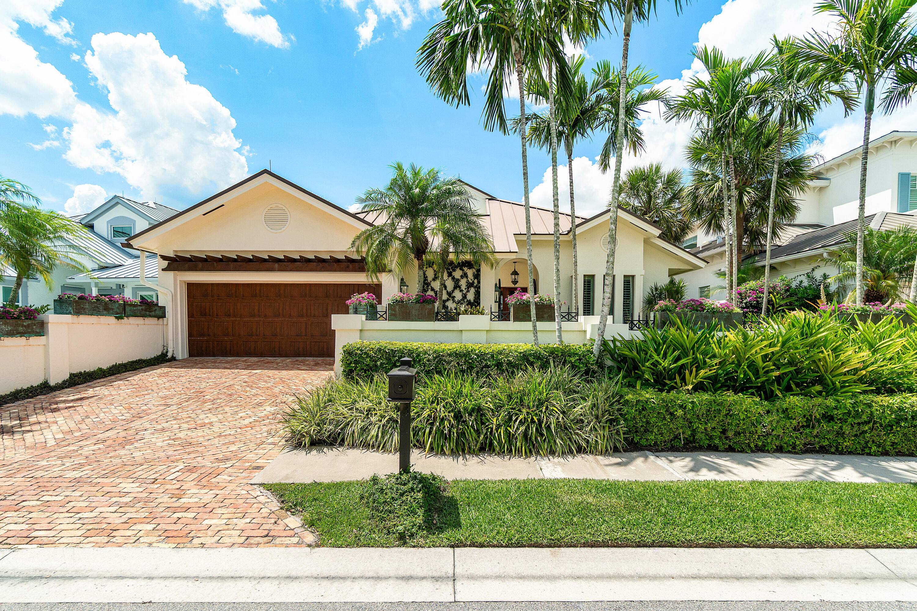The home of an acclaimed interior designer, this impeccably curated residence blends timeless elegance with relaxed Florida sophistication.