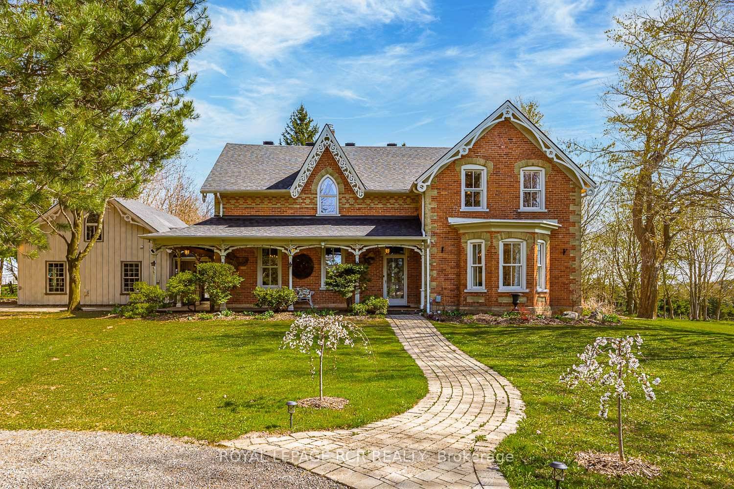 Peace and Tranquility ! This stunning country estate with over 5, 400 sqft of living space and Grand River frontage exudes elegance and class.