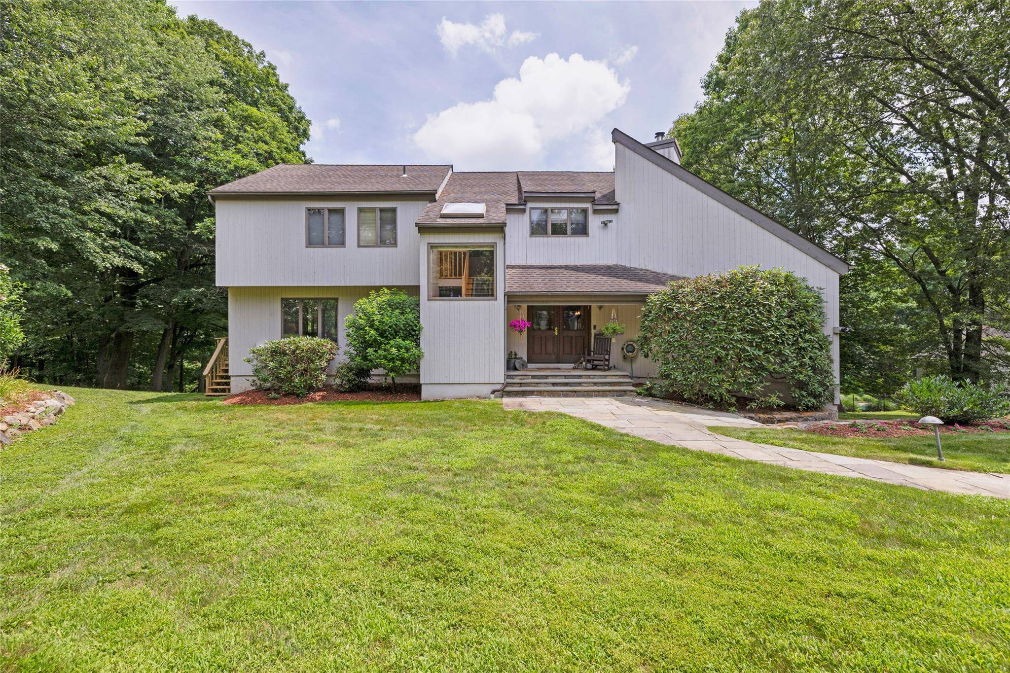 WOW ! Sun filled Contemporary Colonial nested on 1.