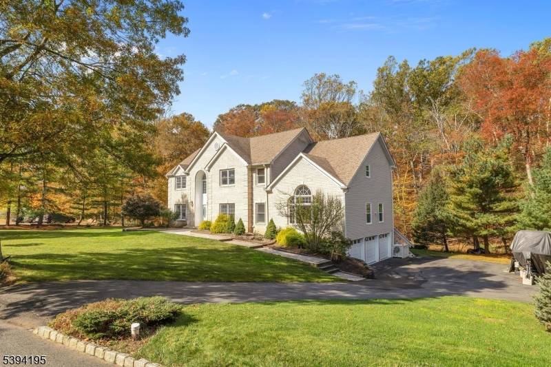 Discover timeless elegance and thoughtful design in this architecturally inspired colonial nestled in the sought after Shongum Lake neighborhood.