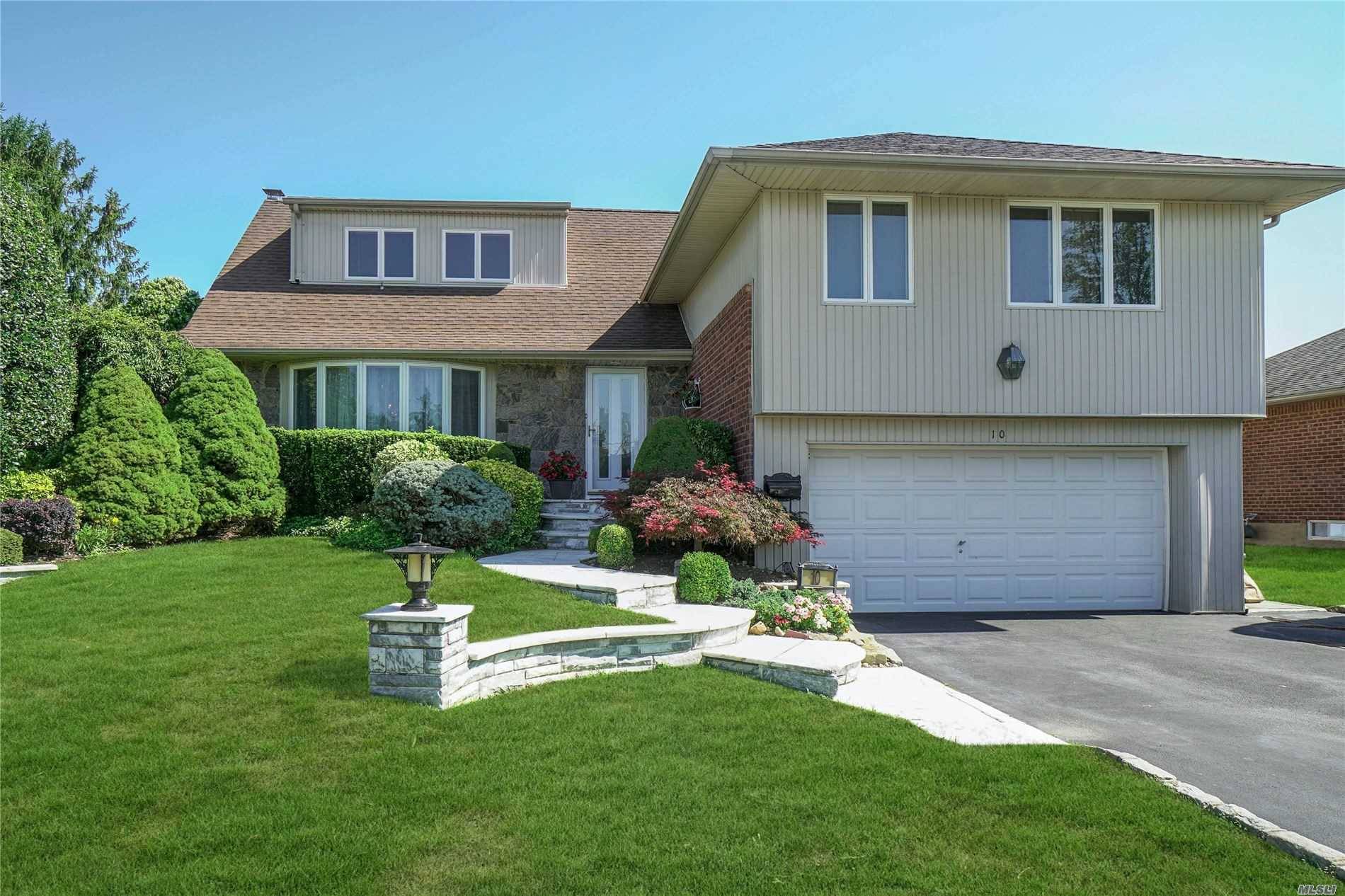 Updated 4 Bedroom split features updated kitchen with breakfast bar and stainless appliances.
