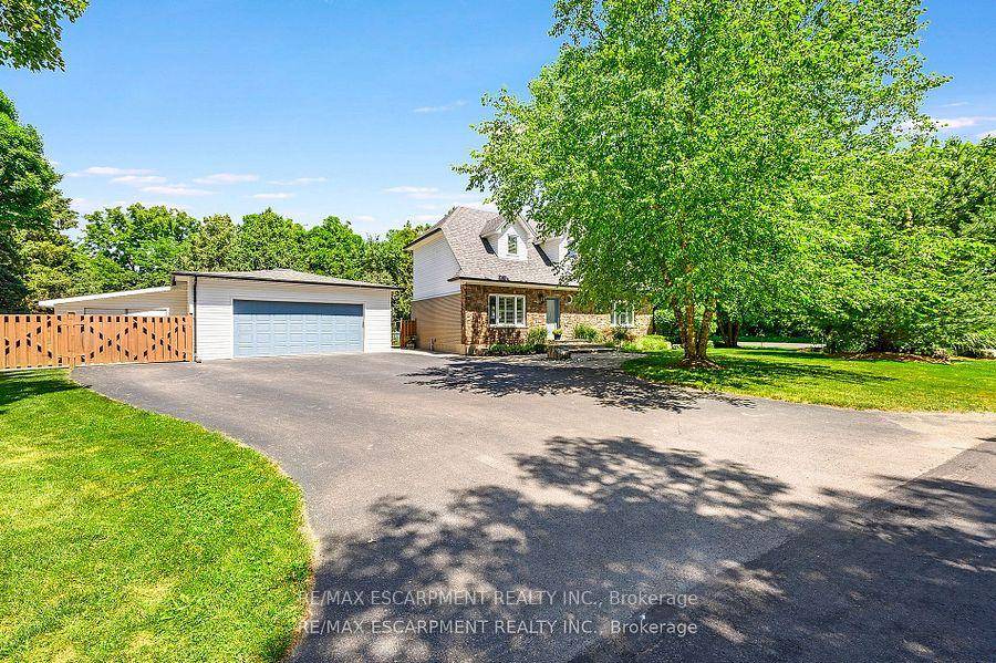Welcome to your dream retreat, a private oasis on nearly half an acre in the charming and sought after community of Killbride.