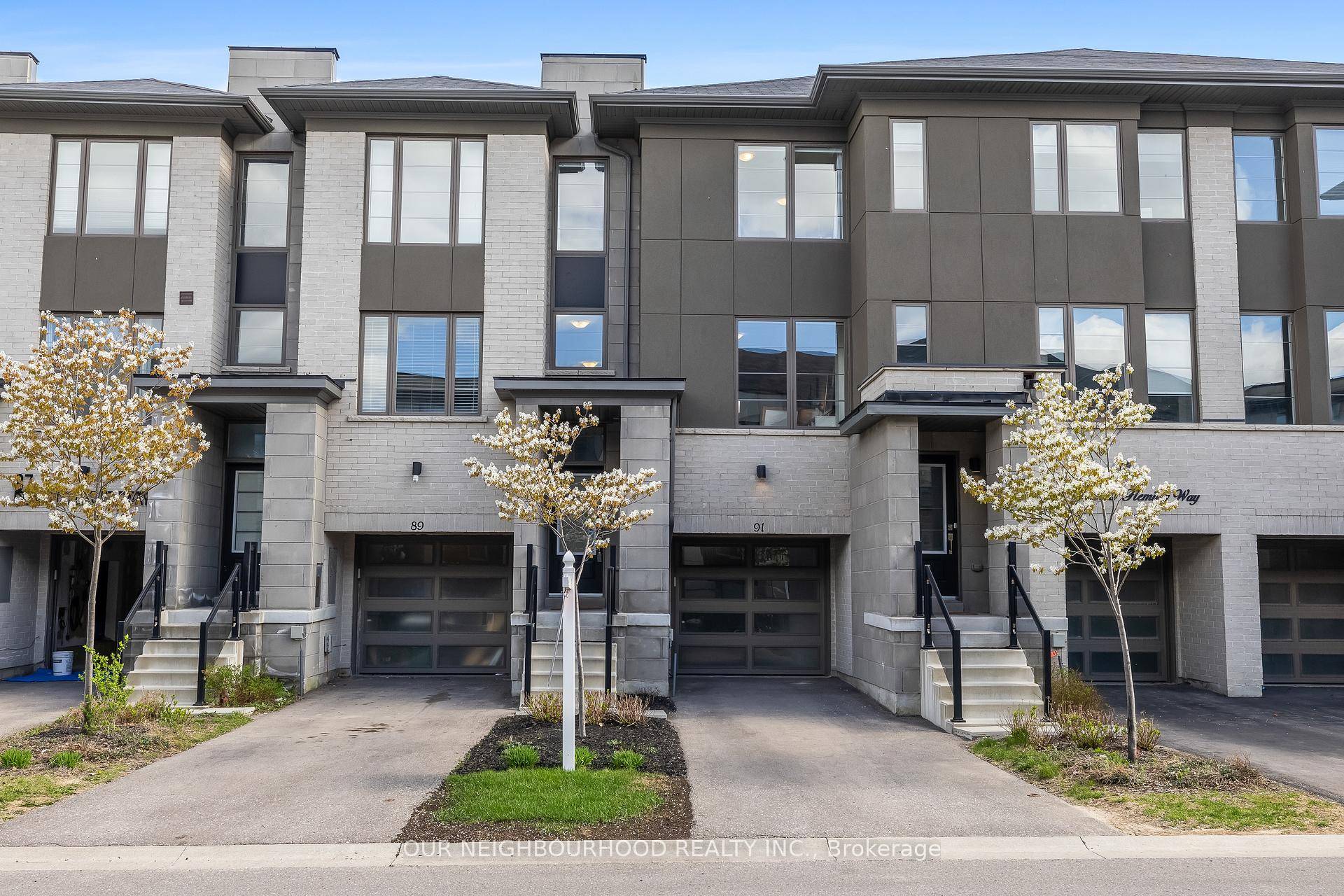 Modern 3 Bedroom Townhome with Rare Tandem Parking in Prime Whitby Location.