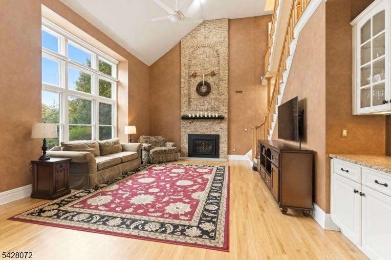 Custom luxury home w rare 2 story owner's wing, 4 oversized BRs, each w direct bath access, 2 offices library spaces, 1st fl laundry, finished basement w 9' ceilings, abundant ...