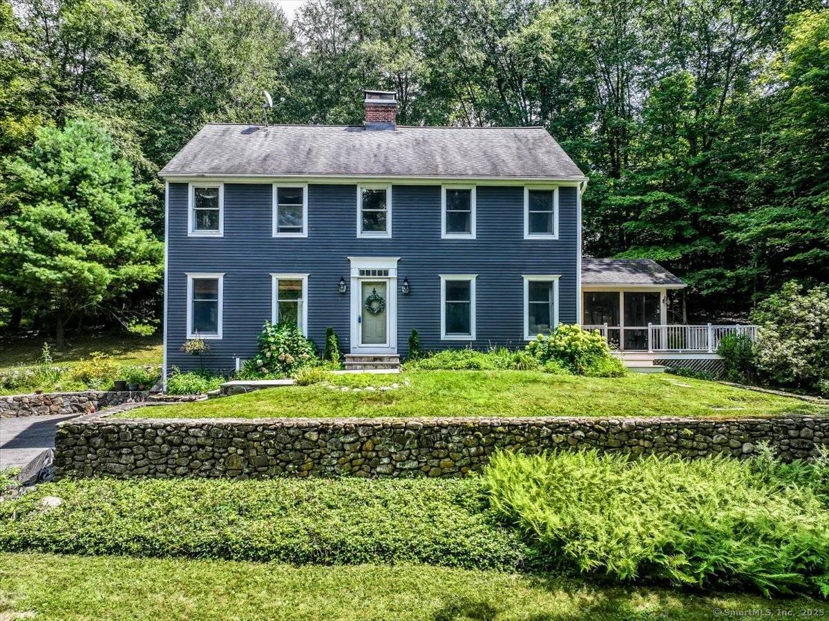 Nestled in a serene, wooded setting just minutes from beautiful Jackson Cove Town Park, this charming 3 bedroom Saltbox blends classic New England style with comfortable living spaces.
