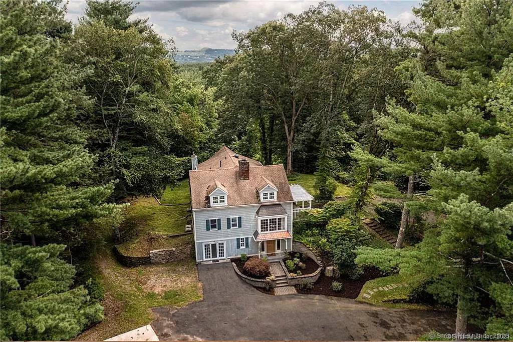 Welcome to 187 W Avon Road, Avon CT, a rare opportunity to own an original Cape Cod style home privately set on 4.