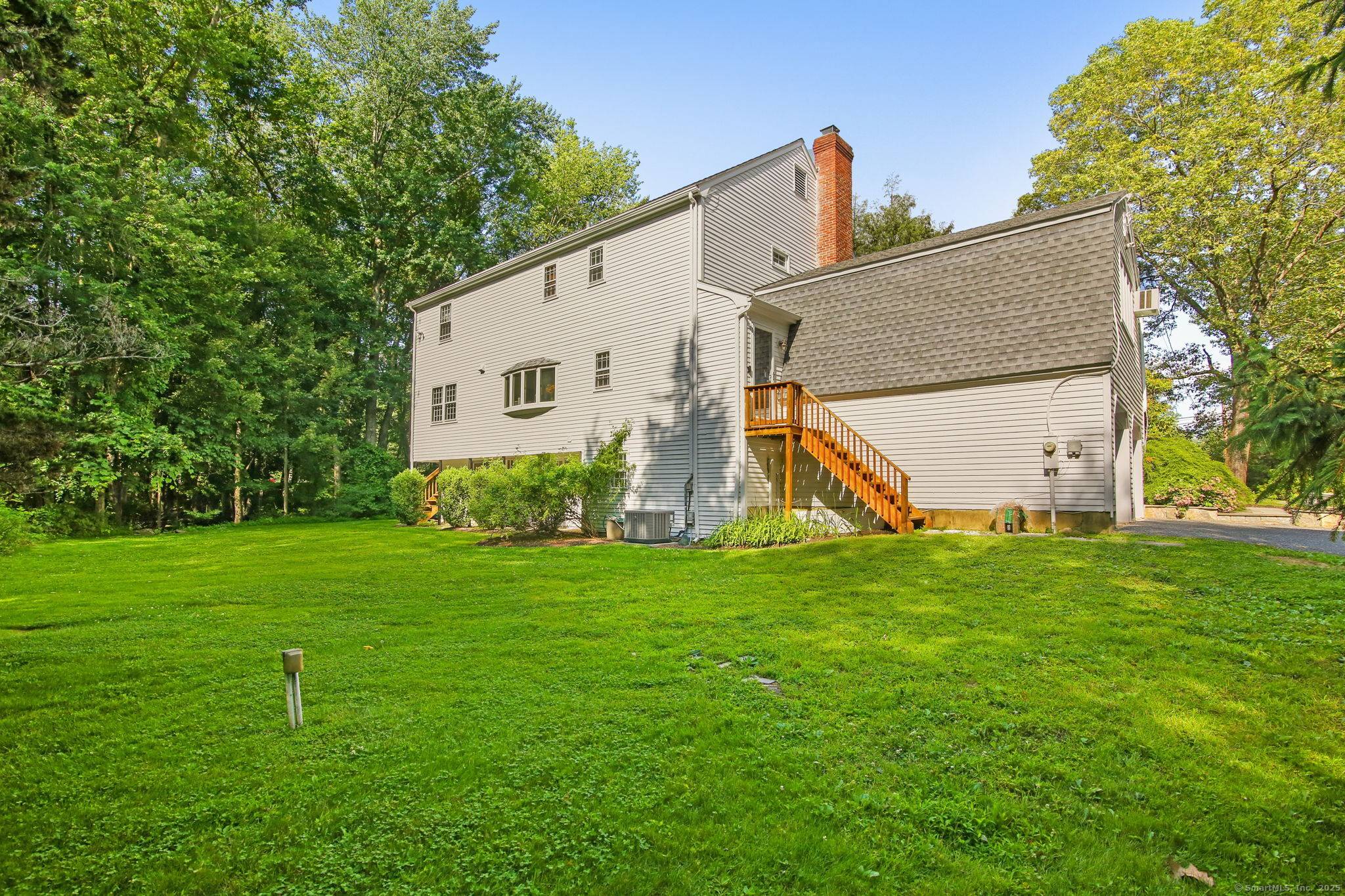 Spacious and gracious turn key Colonial on ideally sited 2 acre property on popular Pipers Hill.
