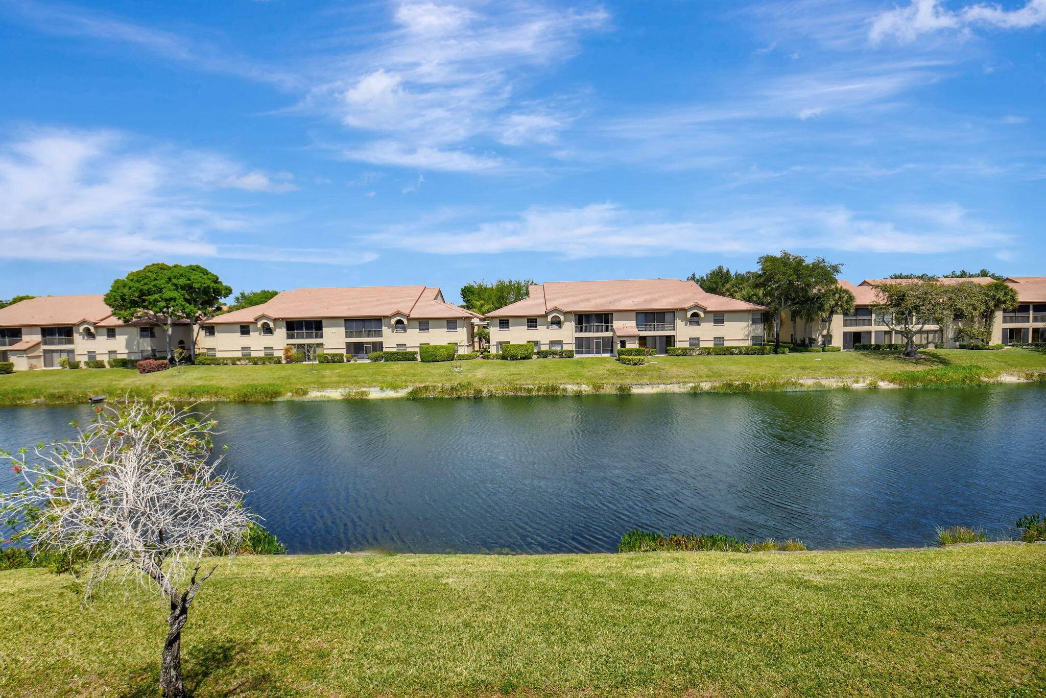 This 1, 692 square foot condo boasts soaring vaulted ceilings and breathtaking views of the lake from the glass and screen enclosed balcony, living room and bedrooms.