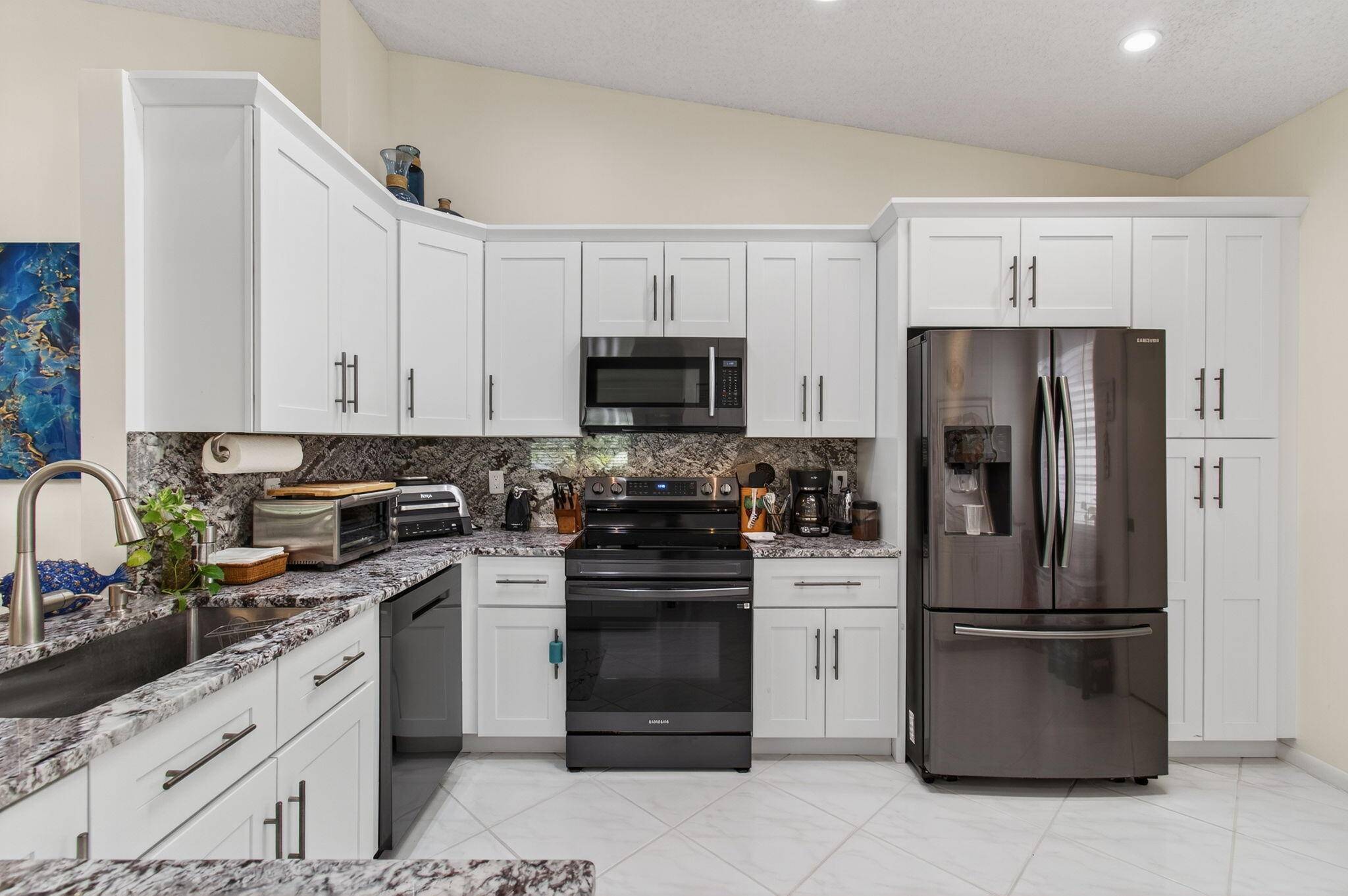 Presenting a stunning villa located at 6368 Mill Pointe Circle in the Active Adult Community 55 of Huntington Pointe, Delray Beach, FL.