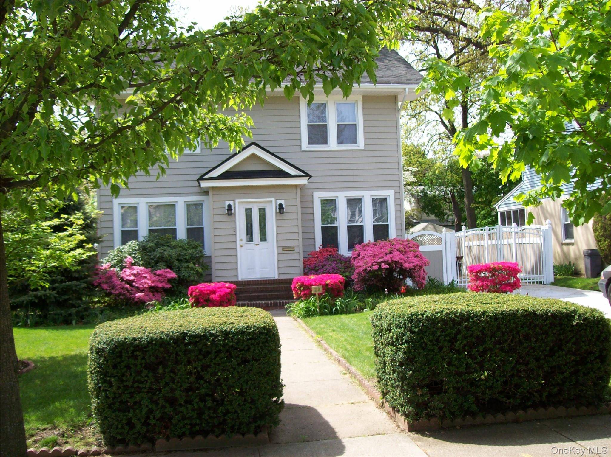 This beautifully maintained colonial style home is nestled on a quiet, tree lined street in the heart of Freeport.