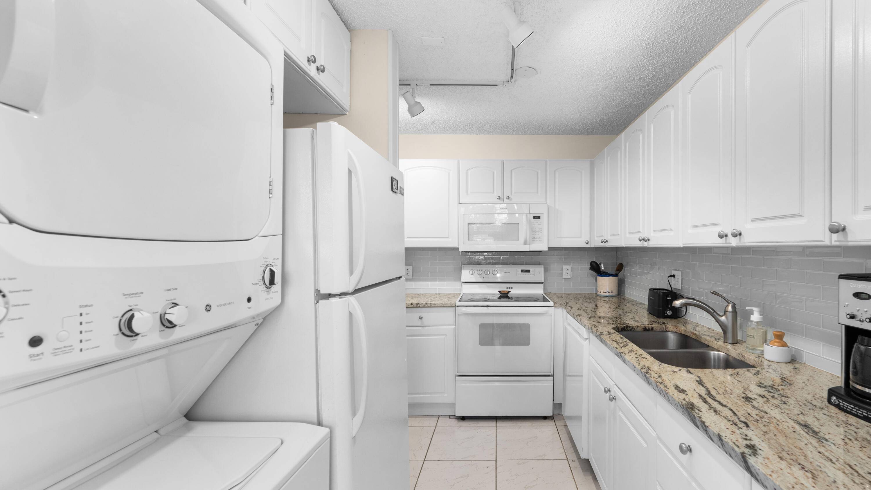 Many upgrades in this lovely 1st floor no steps corner unit that is filled with natural light.