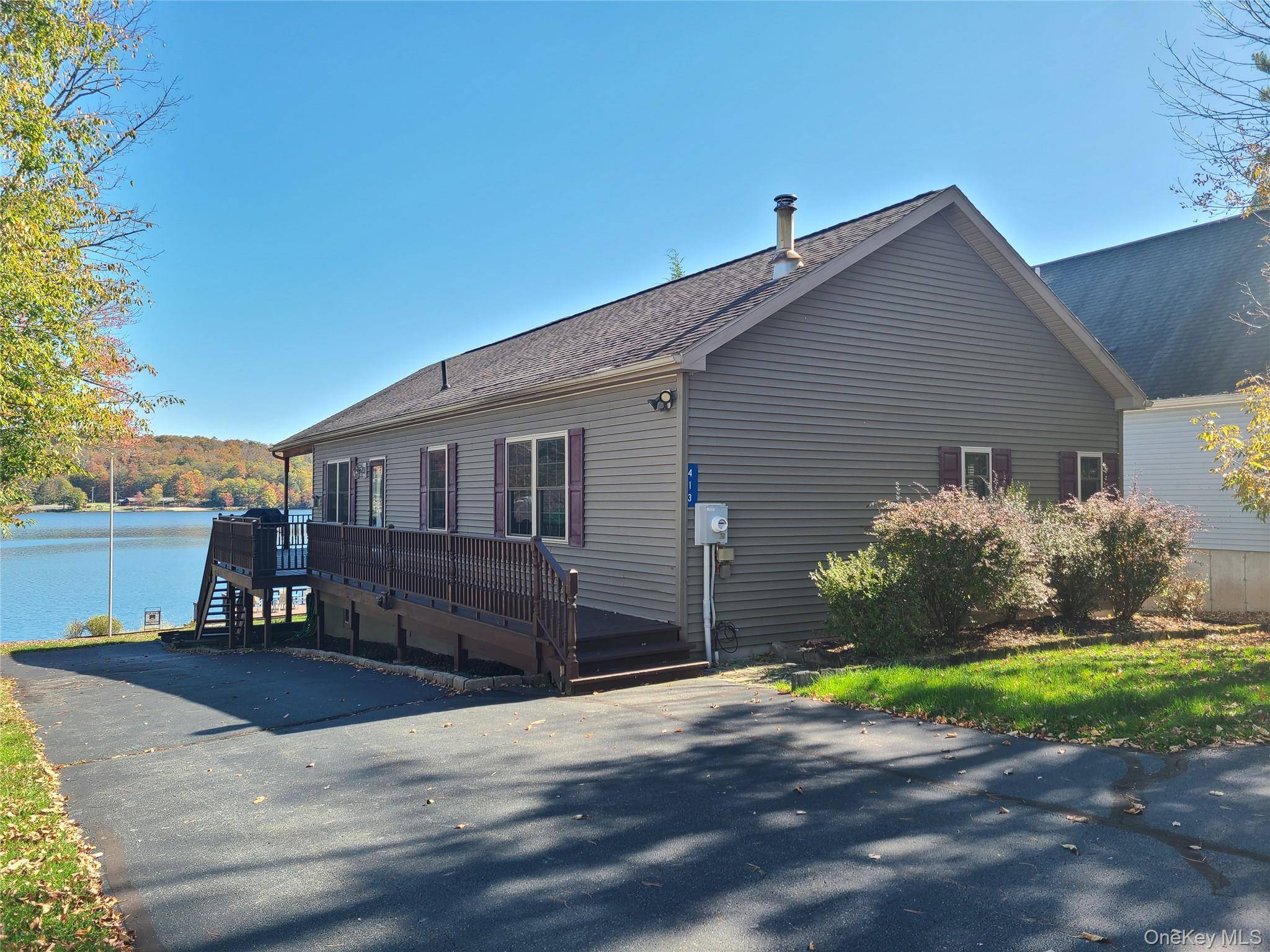 This lakefront beauty on Sackett Lake has been lovingly maintained by the same family since it was built.