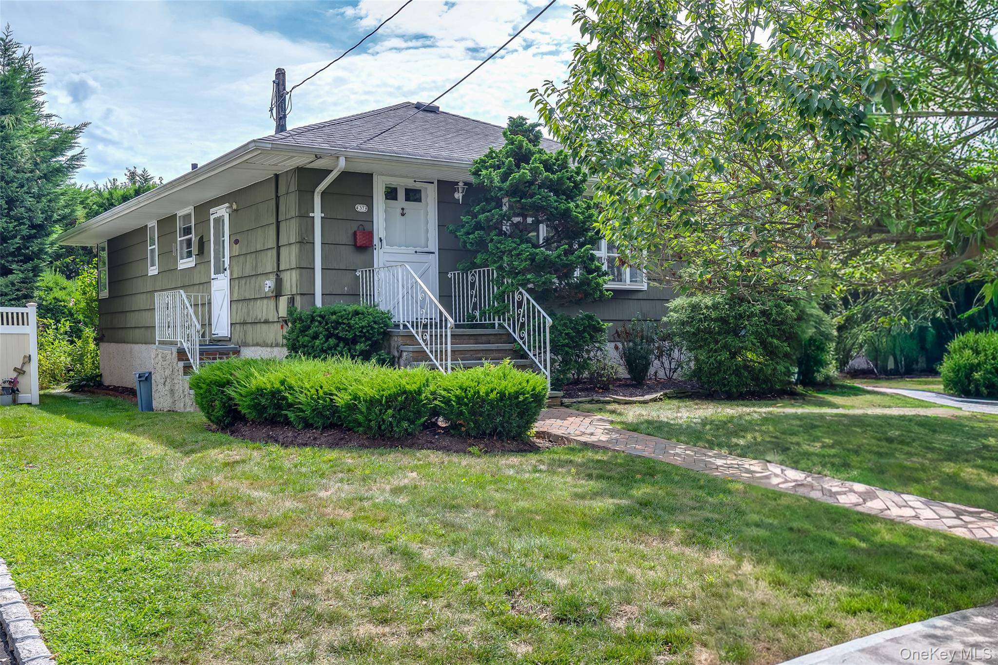 Welcome to 37 Hampton Blvd, A Charming 3 Bedroom, 1 Bath In Line Ranch Located In The Desirable Biltmore Shore Community.
