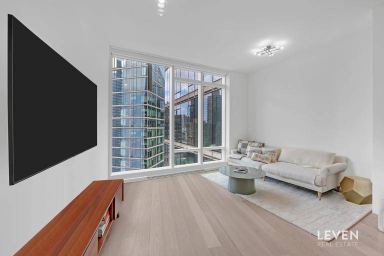 Welcome to Unit 22F at Two Waterline Square, located at 30 Riverside Boulevard in the esteemed Lincoln Square neighborhood.