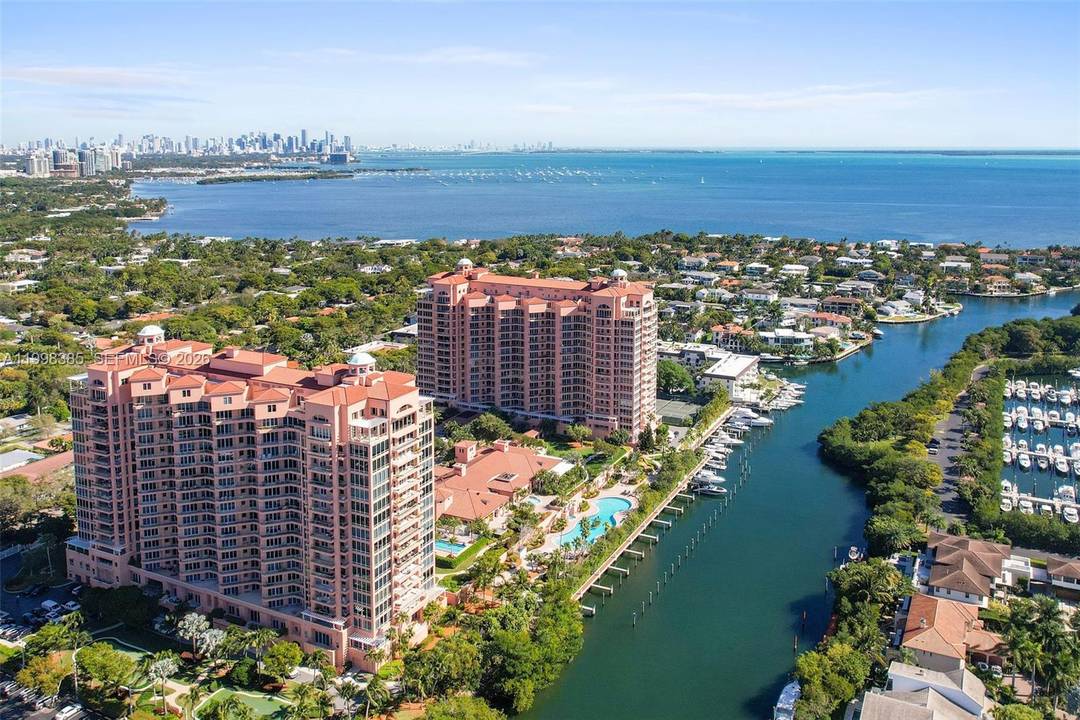 Rarely available at The Gables Club, this impeccable NE corner residence showcases sweeping, unobstructed views of Biscayne Bay, Key Biscayne, Miami Beach, and the Miami skyline.