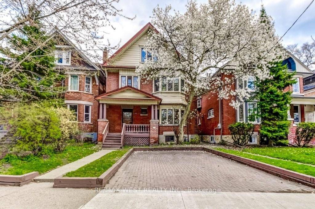 Charming 2. 5 storey detached residence nestled on a rare 33' x 151' lot in coveted High Park !