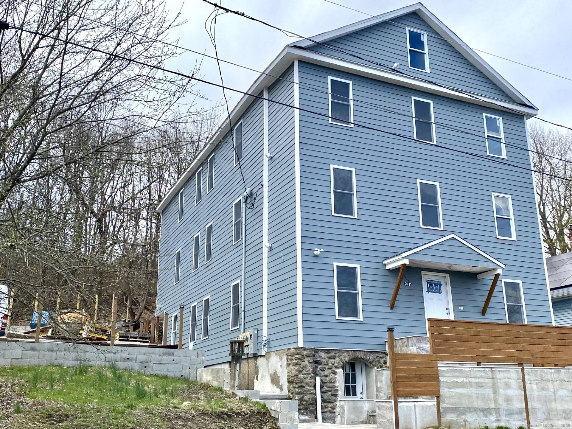 EXEPTIONAL OVERSIZE 3 FAMILY HOME FULLY RENOVATED WITH NEW CONSTRUCTION QUALITY.