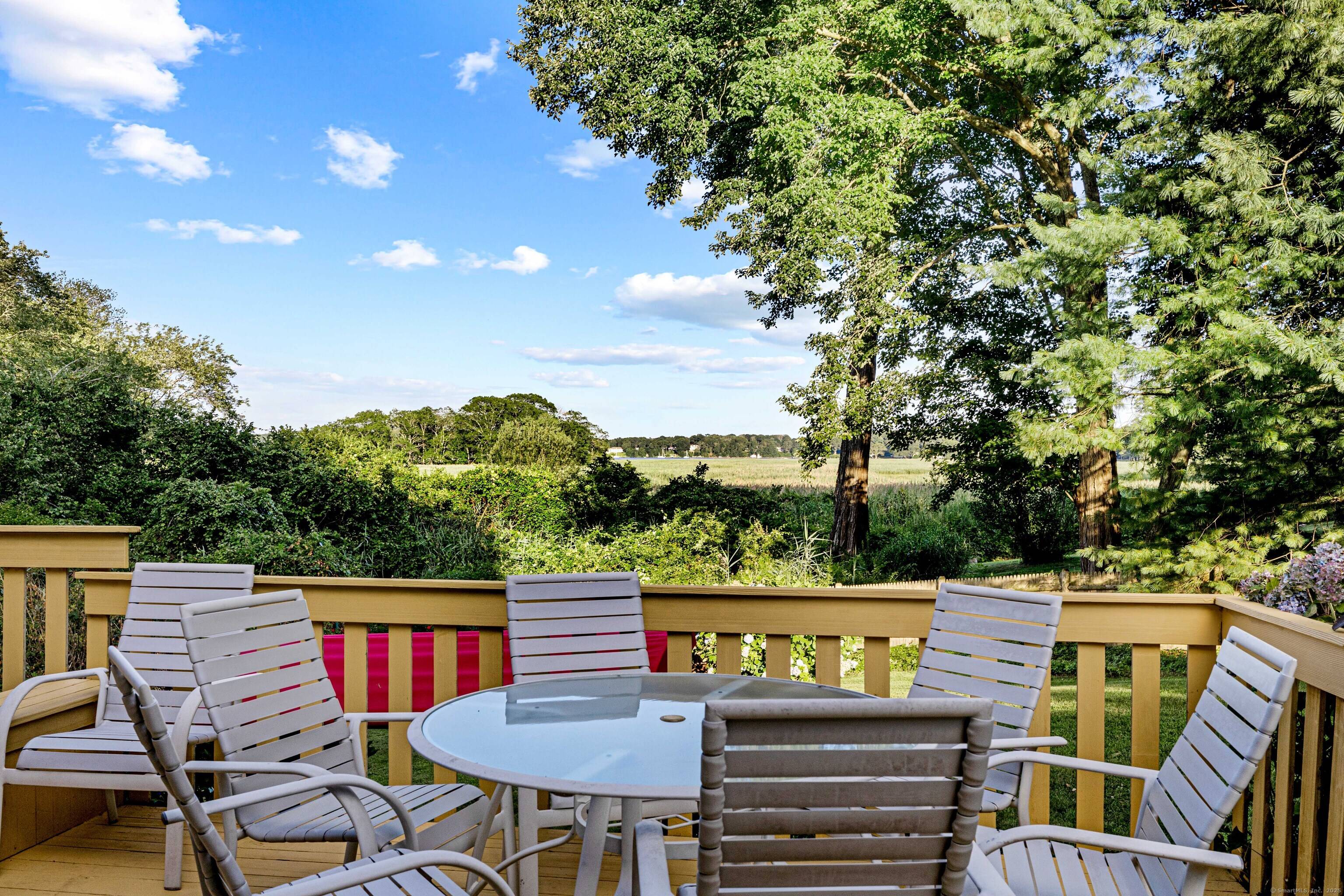 Discover the serenity of Ayers Point in this spacious 3400 sq ft home with captivating views of the Connecticut River and surrounding marshland.